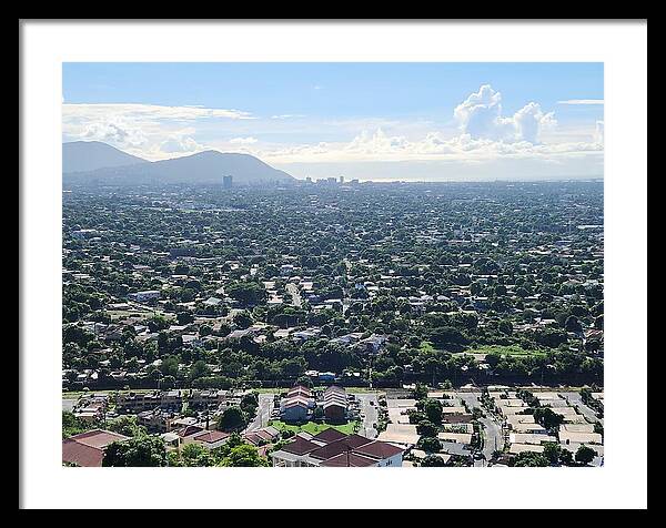Expansive Cityscape Under Blue Skies - Framed Print