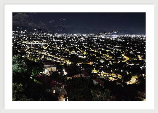 Glowing City Under Night Sky - Framed Print
