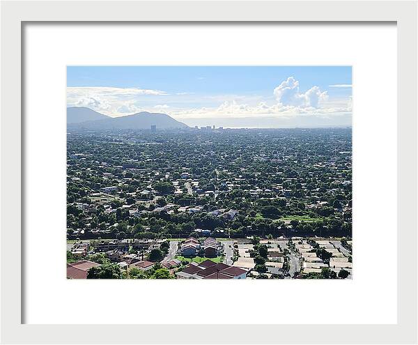 Expansive Cityscape Under Blue Skies - Framed Print
