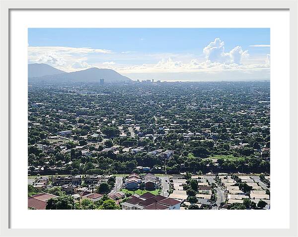 Expansive Cityscape Under Blue Skies - Framed Print