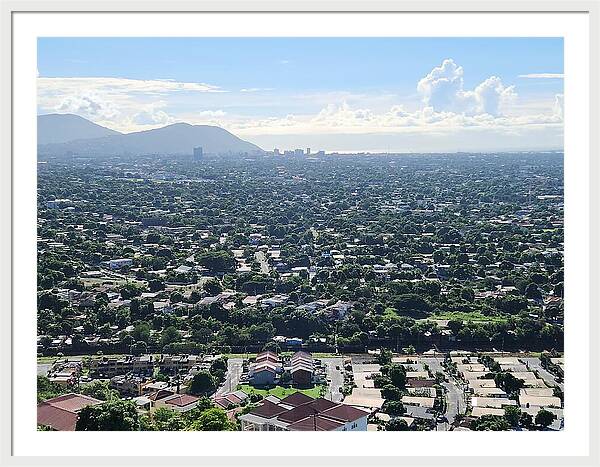 Expansive Cityscape Under Blue Skies - Framed Print