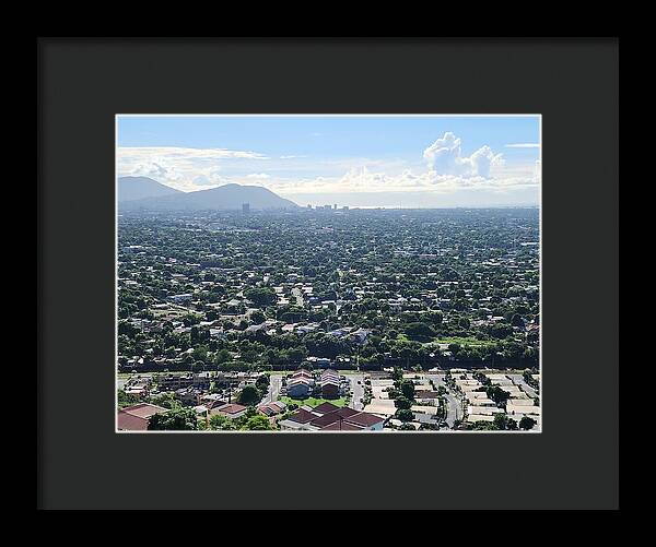 Expansive Cityscape Under Blue Skies - Framed Print