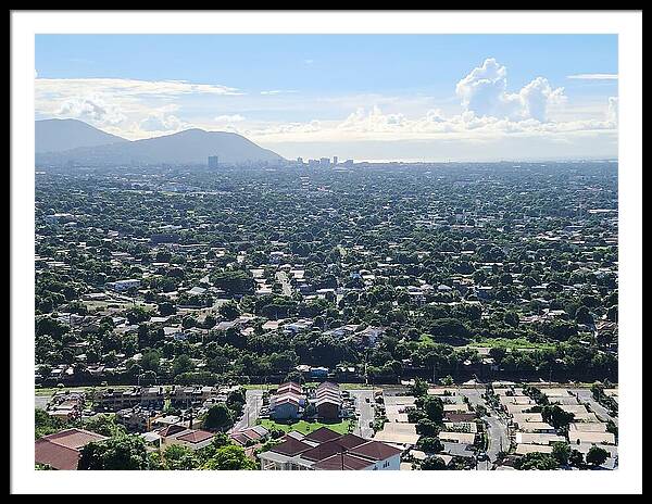 Expansive Cityscape Under Blue Skies - Framed Print
