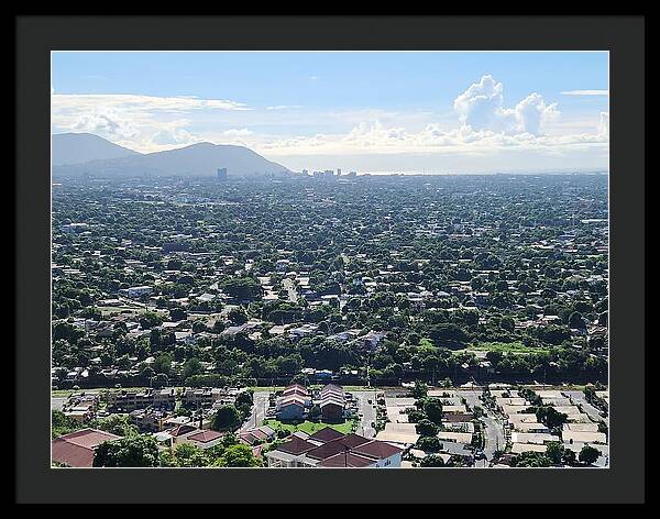 Expansive Cityscape Under Blue Skies - Framed Print