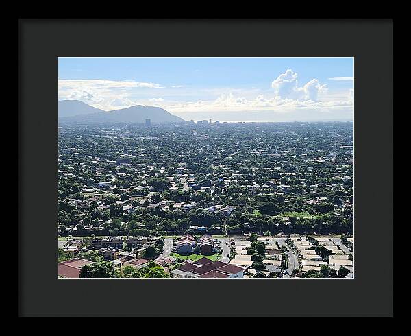 Expansive Cityscape Under Blue Skies - Framed Print