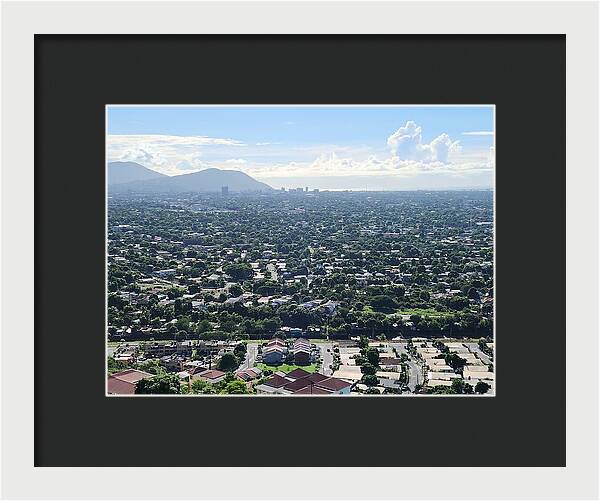 Expansive Cityscape Under Blue Skies - Framed Print