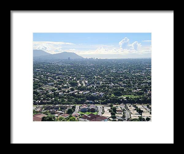 Expansive Cityscape Under Blue Skies - Framed Print