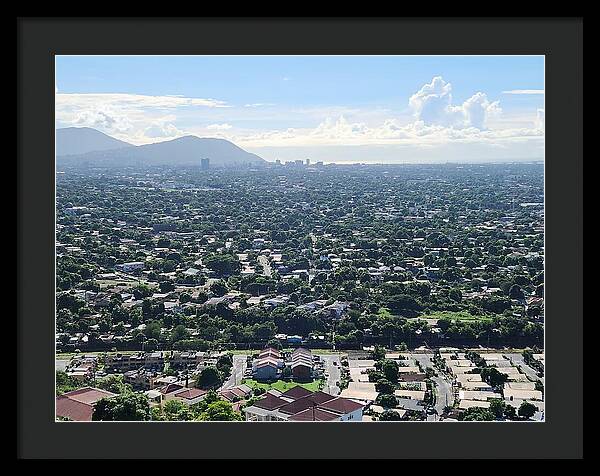 Expansive Cityscape Under Blue Skies - Framed Print