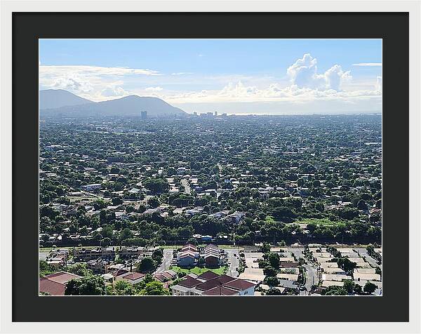Expansive Cityscape Under Blue Skies - Framed Print