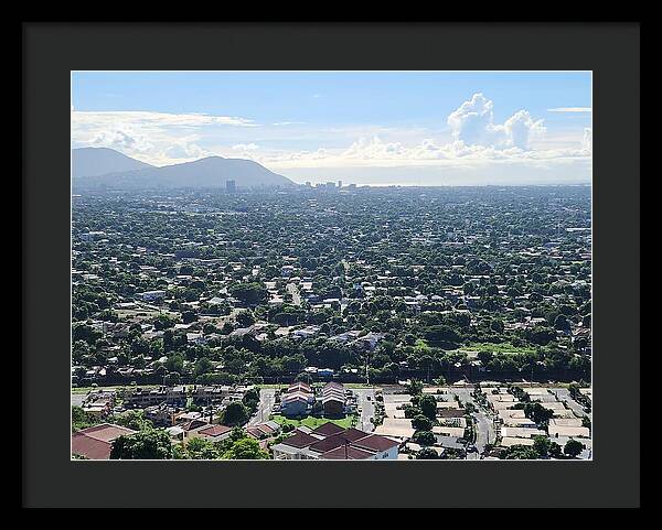 Expansive Cityscape Under Blue Skies - Framed Print