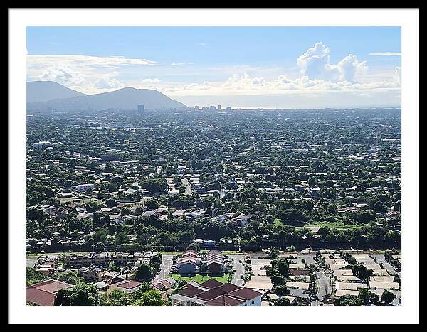 Expansive Cityscape Under Blue Skies - Framed Print