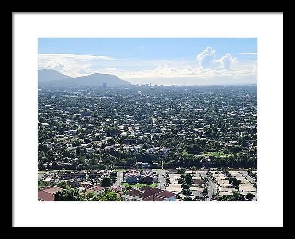 Expansive Cityscape Under Blue Skies - Framed Print