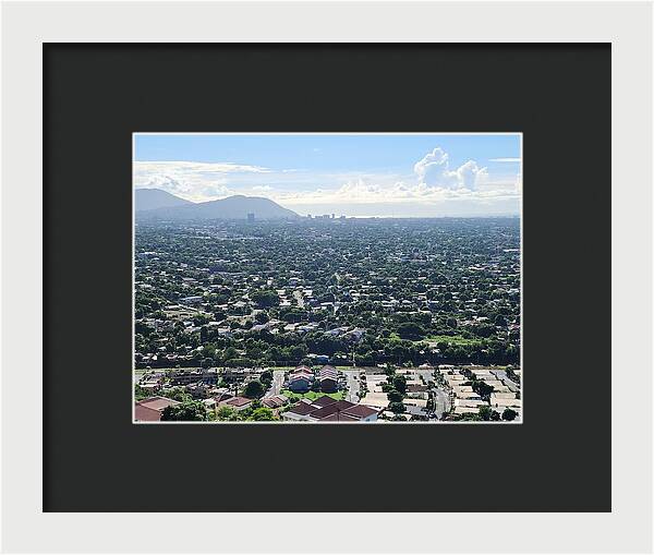 Expansive Cityscape Under Blue Skies - Framed Print