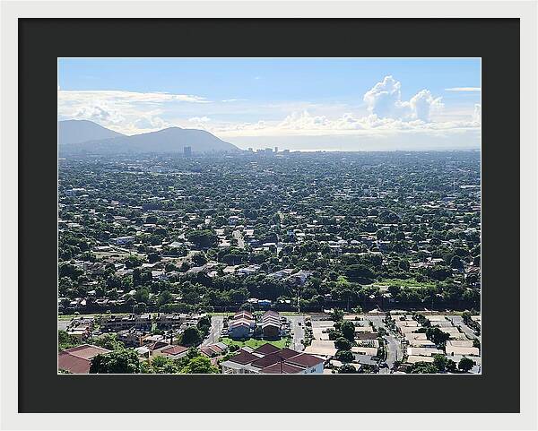 Expansive Cityscape Under Blue Skies - Framed Print