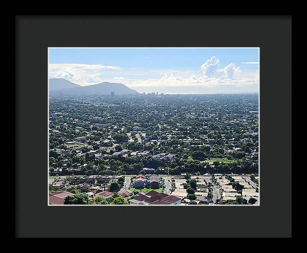 Expansive Cityscape Under Blue Skies - Framed Print