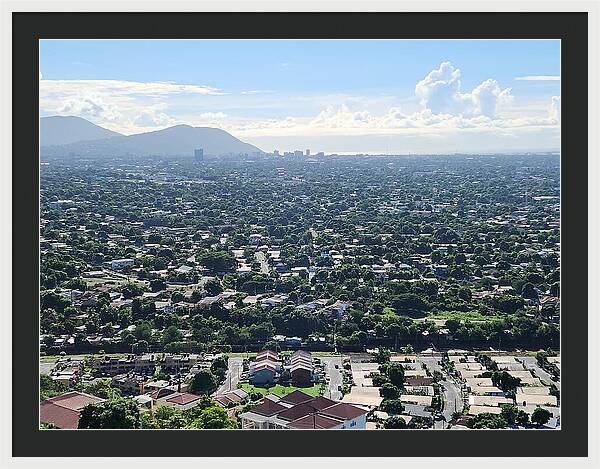 Expansive Cityscape Under Blue Skies - Framed Print