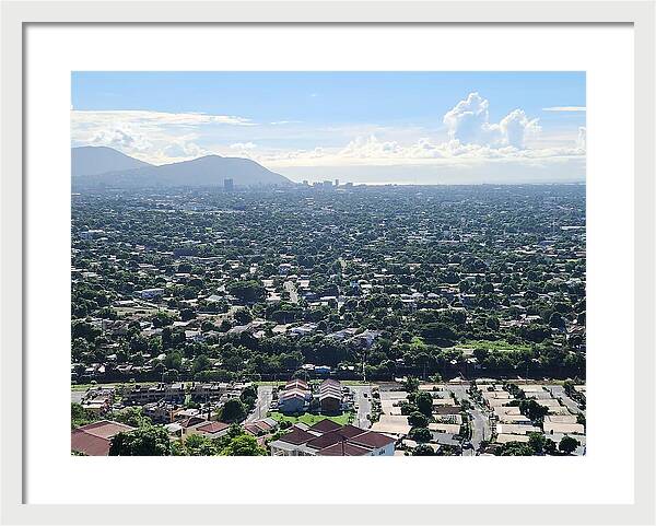 Expansive Cityscape Under Blue Skies - Framed Print