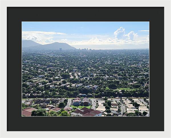 Expansive Cityscape Under Blue Skies - Framed Print
