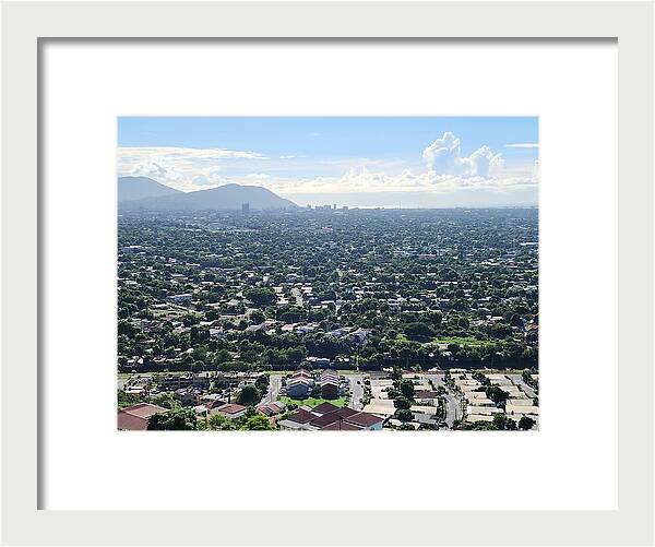 Expansive Cityscape Under Blue Skies - Framed Print