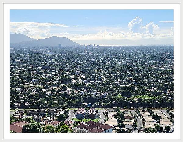 Expansive Cityscape Under Blue Skies - Framed Print