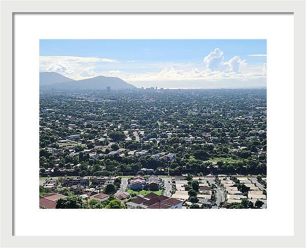 Expansive Cityscape Under Blue Skies - Framed Print