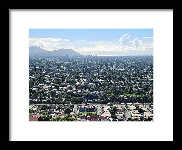 Expansive Cityscape Under Blue Skies - Framed Print