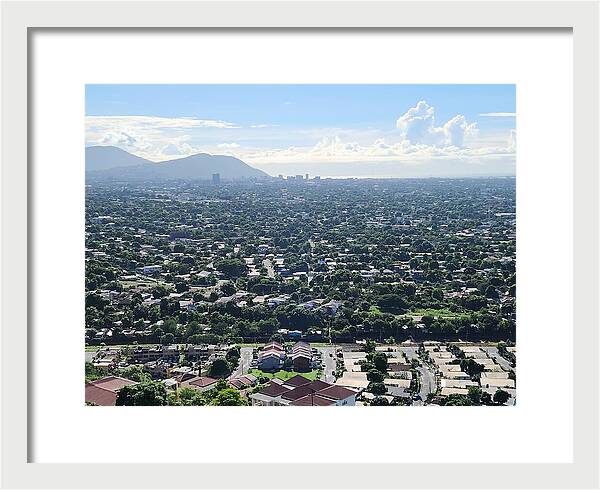 Expansive Cityscape Under Blue Skies - Framed Print