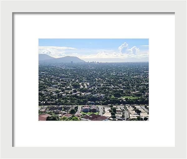 Expansive Cityscape Under Blue Skies - Framed Print