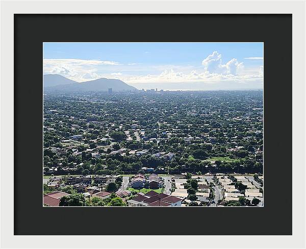 Expansive Cityscape Under Blue Skies - Framed Print